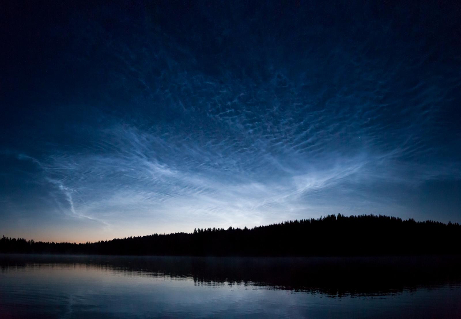 Noctilucent clouds shimmering. Night shining 