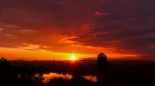Heat concentrates on the south coast Saturday before rain reaches the west Sunday
