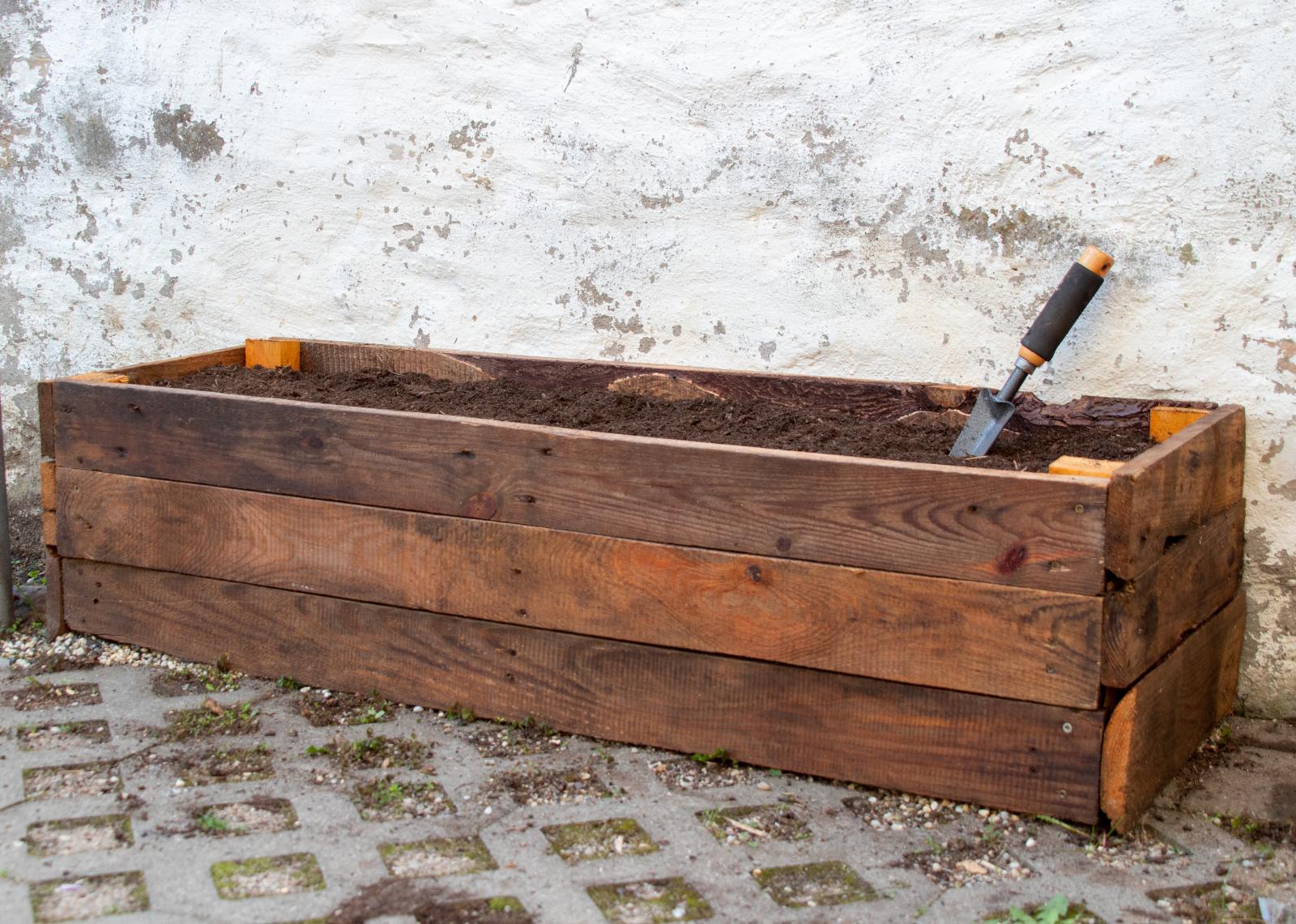 A wooden crate used as a planter