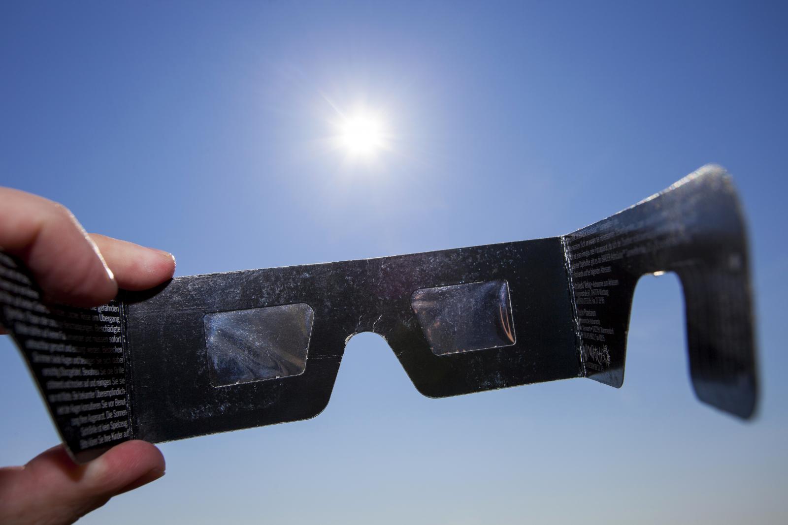 Use eclipse glasses or project the suns image onto a piece of paper to view the solar eclipse