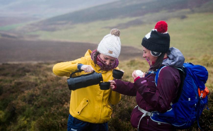 ramblers hikers with a Thermos flask