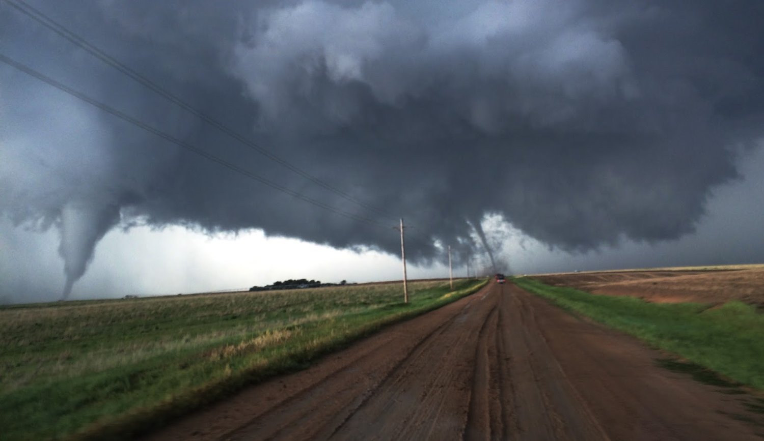 Twin Tornadoes on the Ground - The 3rd would come from the Wall Cloud furthest right.