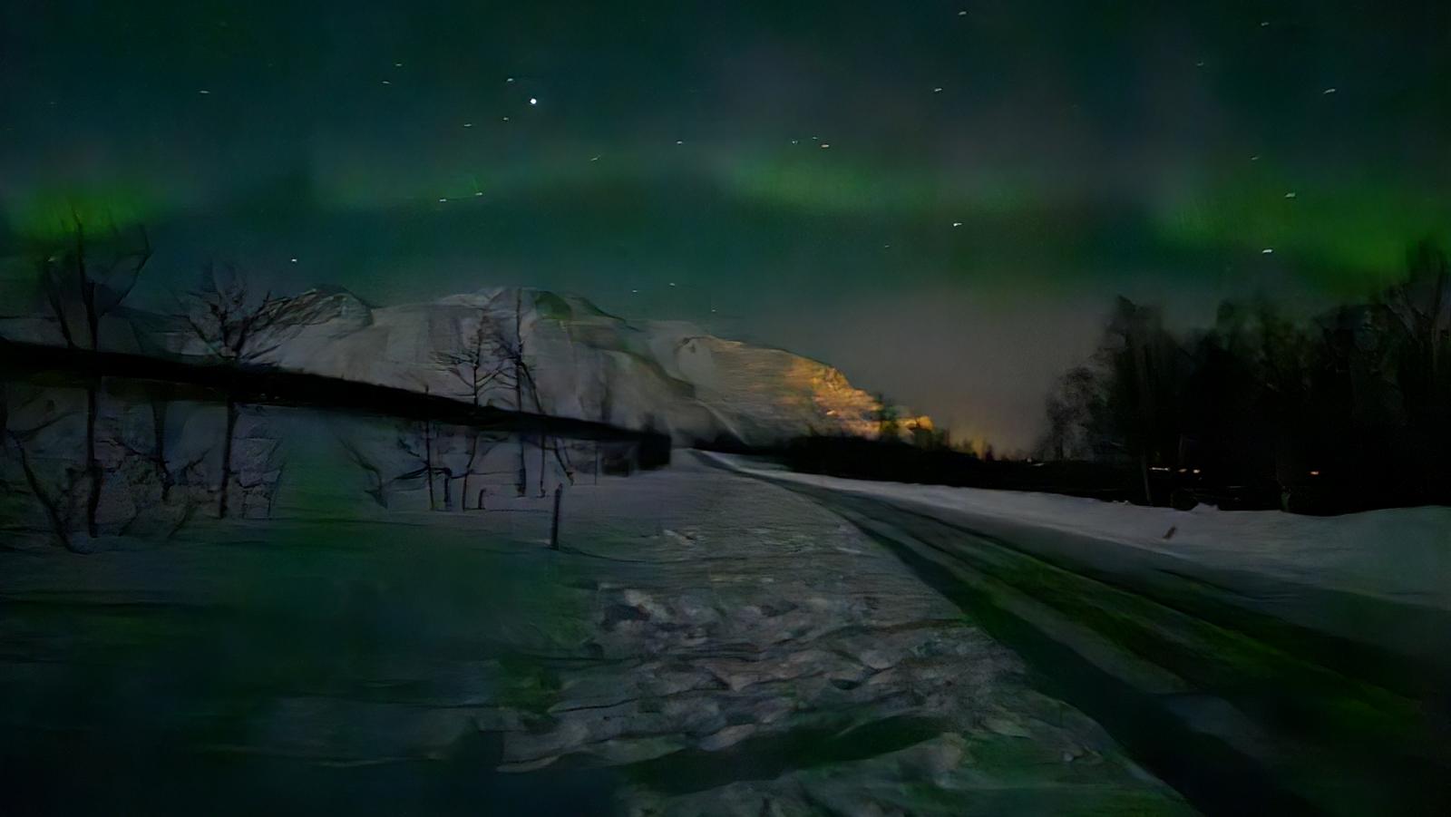 Snowy mountains and the Northern Lights